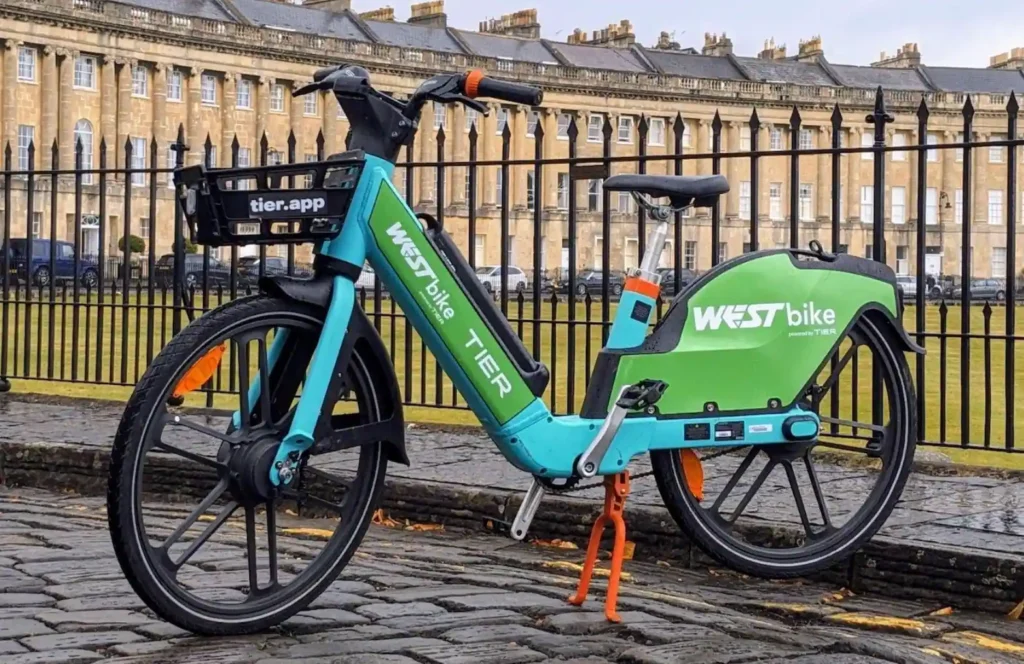 TIER’s signature bright green bike aesthetics and basket integration, reflecting its tech-first, shared-mobility identity.