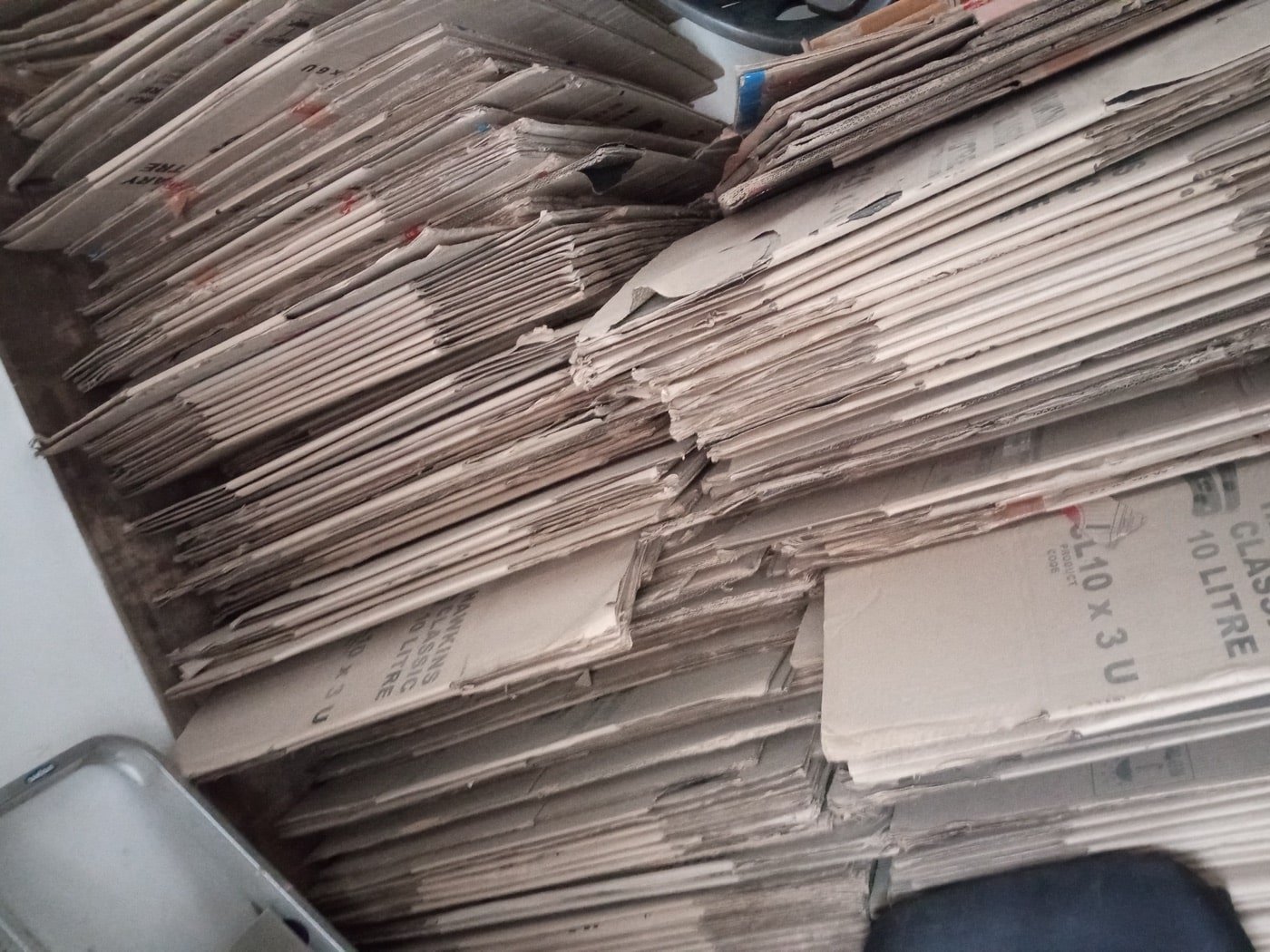 A stack of corrugated cardboard packaging boxes
